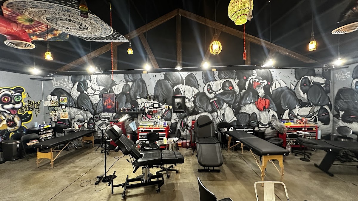 Mural and tattoo chairs inside Redemption Tattoo, Bend