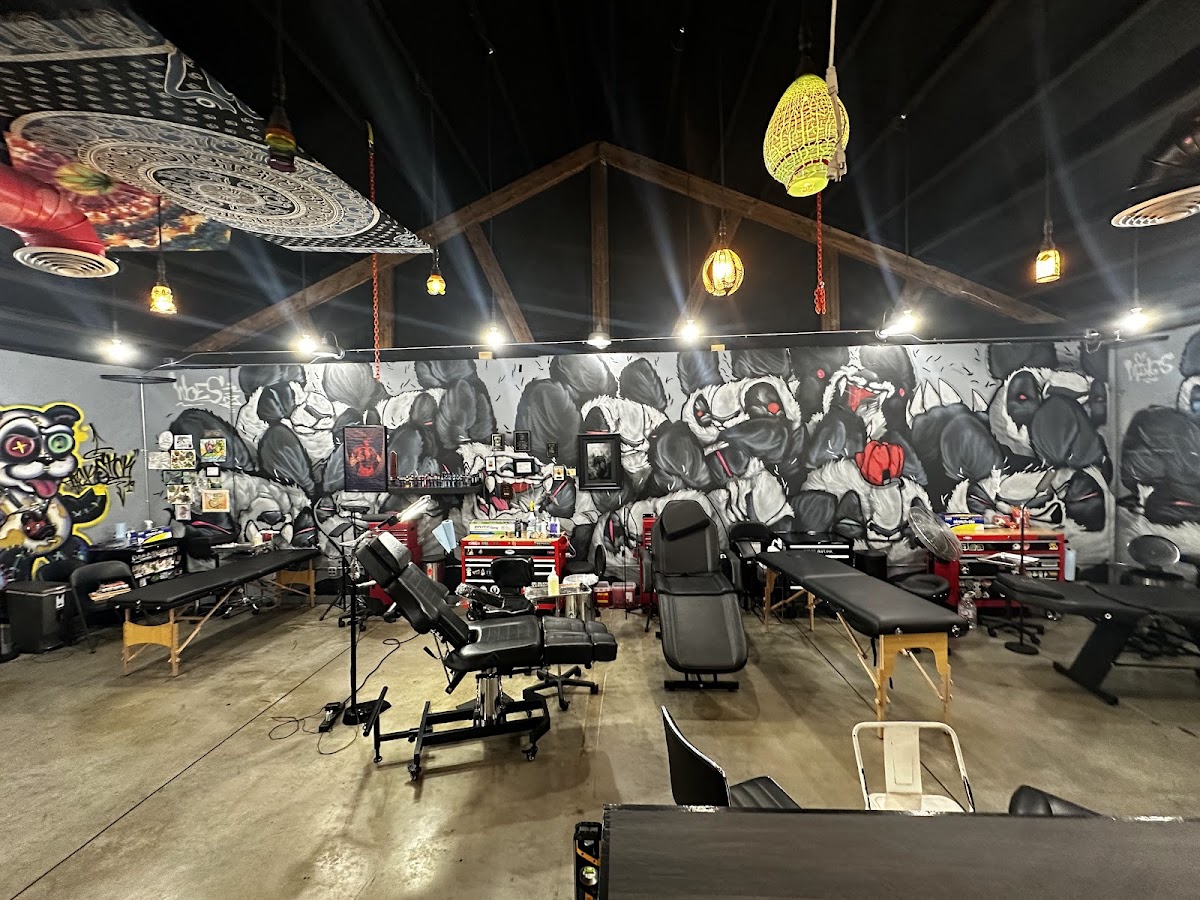 Inside Redemption Tattoo, the muraled studio floor in Bend